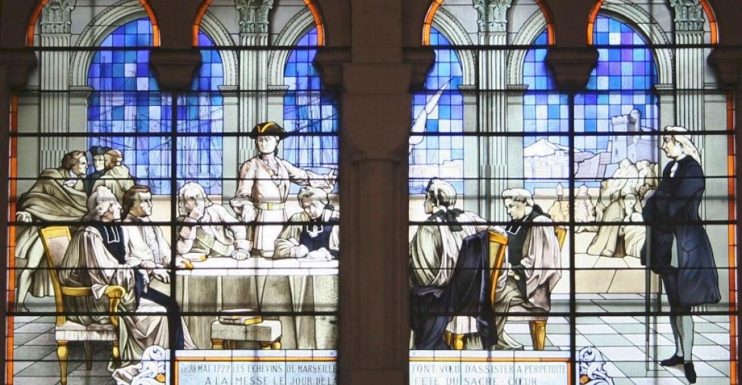 Stained glass window in the Basilica of the Sacred Heart, Marseille, depicting the city council’s vow to hold annual masses.