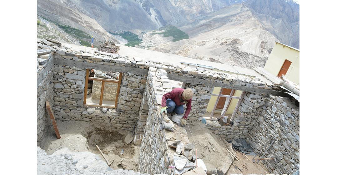 A person building his own house in Malling village near Nako (Kinnaur)