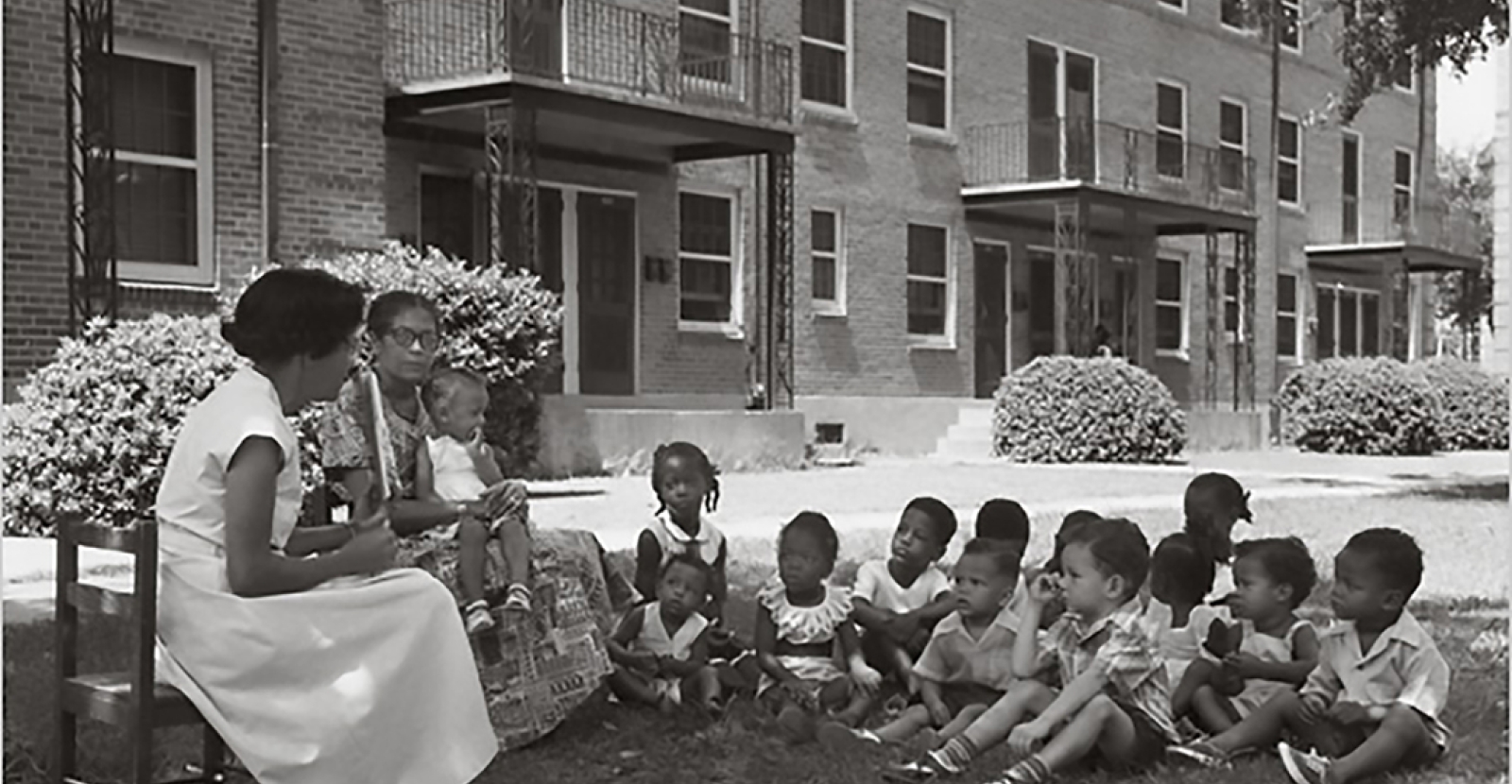 Moms and kids engaged in learning, Lafitte Projects, 1940s
