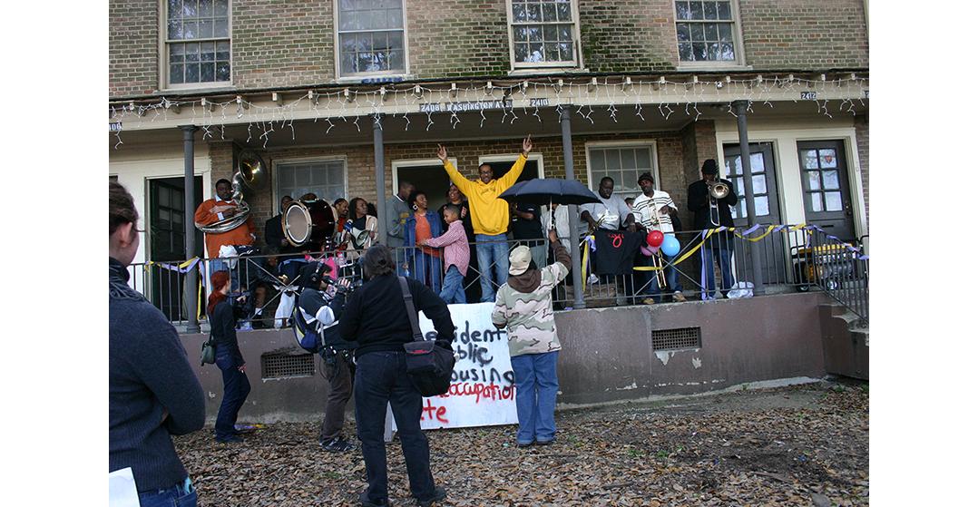 Residents of the CJ Peete/Magnolia projects protest prior to demolition